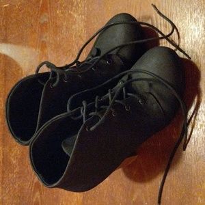 Black lace up boot heel